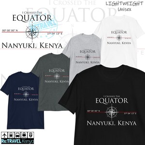 May include: Four t-shirts in different colors, featuring a compass and the text "I crossed the equator, Nanyuki, Kenya, 00° 00' 00" N, 37° 04' 13" E". The t-shirts are available in black, gray, white, and navy blue.