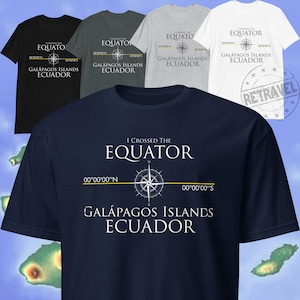 May include: A navy blue t-shirt with white text that reads "I crossed the equator" and "Galapagos Islands Ecuador". A compass with a north arrow is centered on the shirt with the coordinates 00°00'00"N and 00°00'00"S.