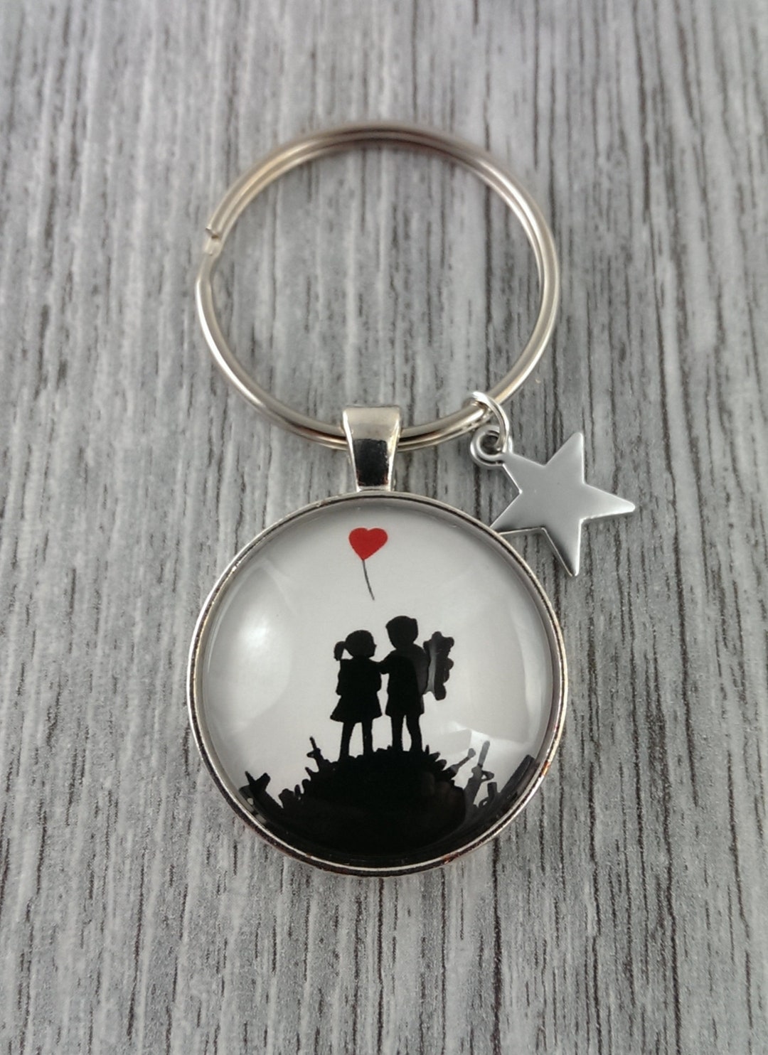 1 Keychain ' Kids on Guns ' by Banksy Etsy