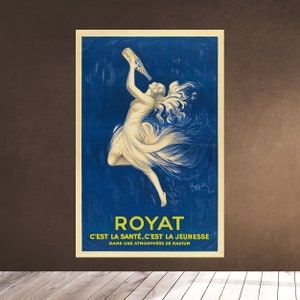 May include: Vintage poster featuring a woman in a flowing white dress, drinking from a bottle against a deep blue background. The poster has the word "ROYAT" in large yellow letters, with French text below. The artwork has a classic, art nouveau style.