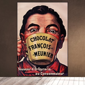 Puede incluir: Cartel publicitario vintage que muestra a un hombre con los ojos muy abiertos sosteniendo una gran taza amarilla. La taza tiene las palabras "Chocolat François-Meunier" impresas. El cartel también incluye el texto "Souvenir d'Orfèvrerie au Consommateur".