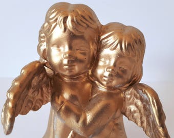 Golden twin angels figure