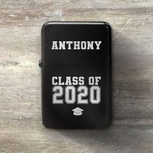 May include: Black lighter with white text that reads "ANTHONY CLASS OF 2020" and a graduation cap symbol.