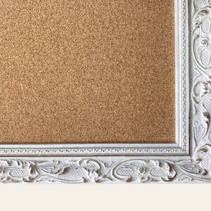 Decorative white wooden framed cork pin board