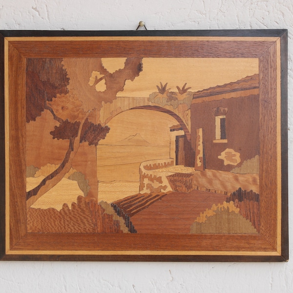 Cuadro con incrustaciones de madera con un vistazo de un paisaje marino y una vista del Vesubio al fondo