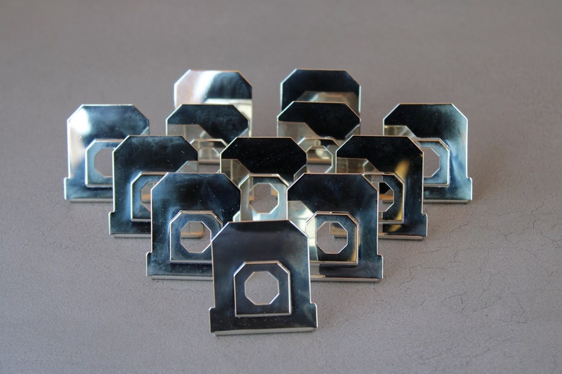 12 silver-plated placeholder mounts