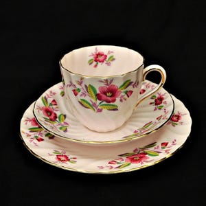 Tuscan tea set trio fine bone china pale pink tea set swirl England set cup and two saucer ornate floral patterns and golden 24k rims
