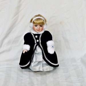 vintage large porcelain winter doll with stand art doll display doll vanity decor dressed wearing a coat of gloves and a silver dress