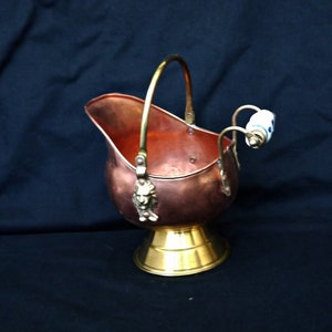 antique copper and brass coal helmet small coal scuttle with handle ceramic blue and white ornate lion head planter coal bucket on base pot