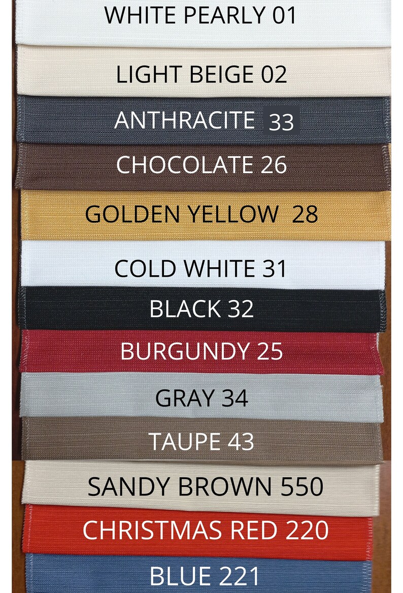 May include: A color swatch chart featuring twelve horizontal fabric strips in various colors, each labeled with a name and number: White Pearly 01, Light Beige 02, Anthracite 33, Chocolate 26, Golden Yellow 28, Cold White 31, Black 32, Burgundy 25, Gray 34, Taupe 43, Sandy Brown 550, Christmas Red 220, and Blue 221.