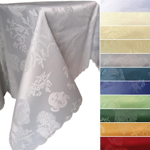 May include: A white tablecloth with a scalloped edge and a repeating pattern of sea life, including fish, coral, and seaweed. The tablecloth is shown folded in a corner, with a variety of color options displayed on the right side of the image.