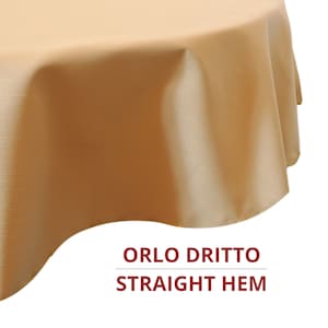 May include: A solid light tan tablecloth with a smooth, draped texture and a straight hem. The fabric features a subtle, fine horizontal line pattern throughout. Below the fabric, the text reads ORLO DRITTO STRAIGHT HEM in dark red.