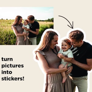 May include: A family of three, a woman, a man, and a child, are standing in a field. The woman is wearing a beige dress, the man is wearing a black shirt and khaki pants, and the child is wearing a white shirt and blue shorts. The family is smiling and looking at the camera.