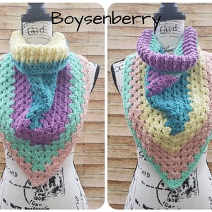 May include: A crocheted cowl in shades of pink, green, yellow, and purple. The cowl is displayed on a mannequin. The text "Boysenberry" is visible in the image.
