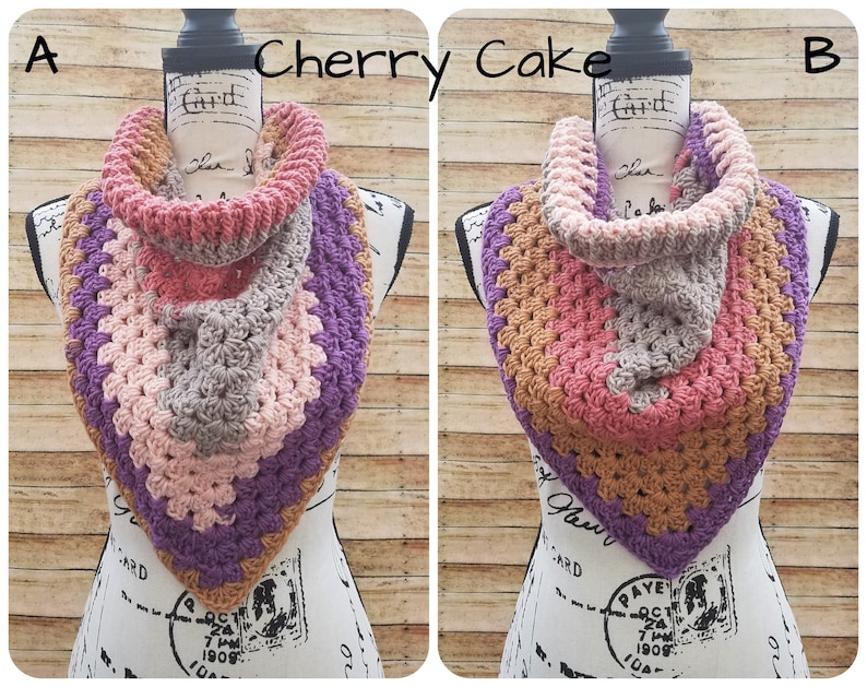 May include: A crocheted cowl in shades of brown, pink, and purple. The cowl is folded and draped over a mannequin's neck. The image is labeled "Cherry Cake" and "A" and "B".