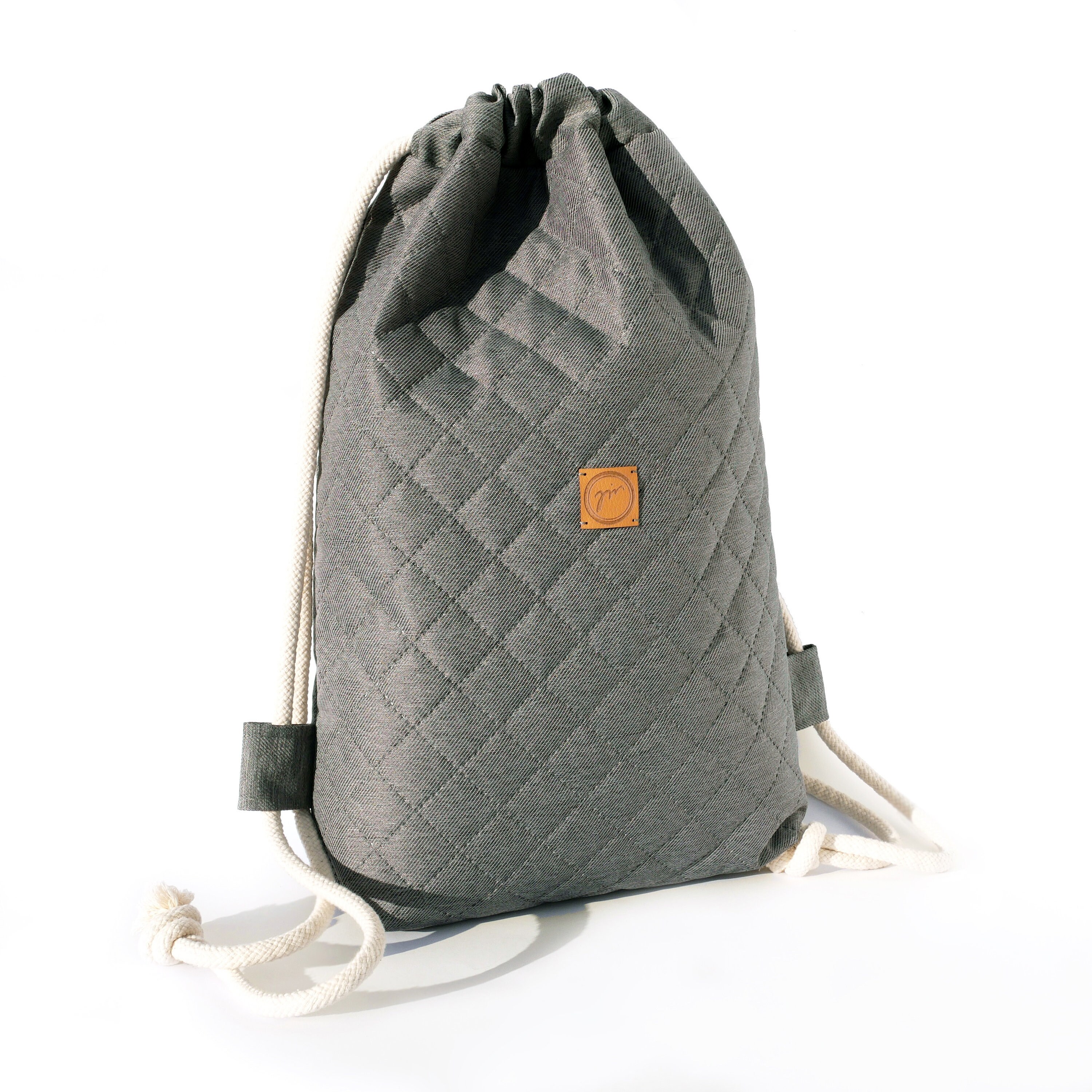 grey quilted backpack