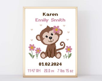 May include: A framed cross-stitch featuring a brown monkey with a pink flower, surrounded by pink flowers and hearts. The text reads "Karen Emily Smith" and includes the date, time, height (20.0 in), and weight (7 lbs 15 oz).