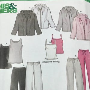 May include: A New Look 6142 sewing pattern envelope featuring illustrations of clothing designs including zip-up hooded jackets, tank tops, camisoles, and drawstring lounge trousers in various colours like black, grey, white, and pink for sizes 8-18.