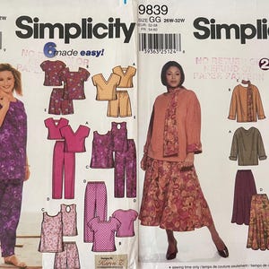 May include: Two Simplicity sewing pattern envelopes, 9772 and 9839, in size GG. Pattern 9772 shows purple floral tops and trousers. Pattern 9839 features a peach top, scarf, and floral skirt. Both envelopes display illustrations of various garment options.