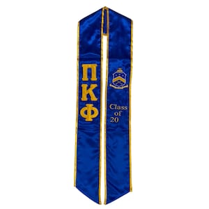 May include: Blue graduation stole with gold lettering and a crest. The lettering reads "ΠΚΦ" and "Class of 20".