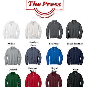 May include: A color chart of 12 different colors of 1/4 zip sweatshirts. The colors are: white, heather grey, charcoal, black heather, oxford, heather navy, royal blue, navy, forest green, red, maroon, and black.