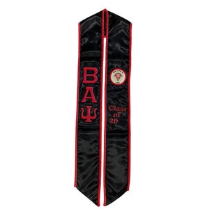 May include: Black graduation stole with red trim and the letters "B.A.Ψ" embroidered in red. The stole also has a red and white circular patch with the text "Beta Alpha Psi" and a diamond symbol. The text "Class of 20" is embroidered in red on the right side of the stole.