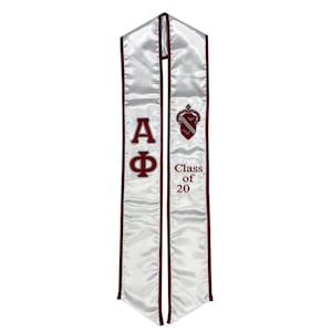 May include: White graduation stole with maroon trim and embroidered letters "AΦ" and "Class of 20".