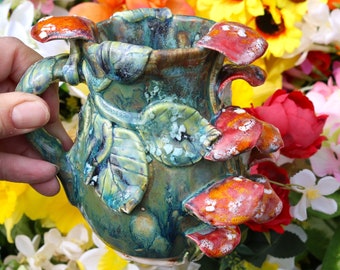 Hand made mushroom mug with green drippy glaze and red protruding toadstools, toadstool mug, mushroom mug, green toadstool mug, mycology