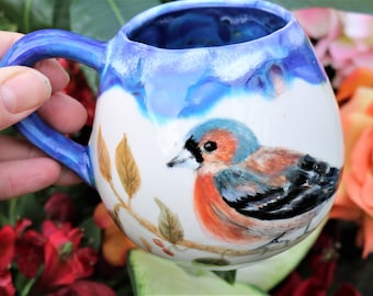 Hand painted gold finch mug with hand sculpted ceramic leaves and drippy blue glaze, bird mug, chaffinch mug, watercolour bird mug, bird art