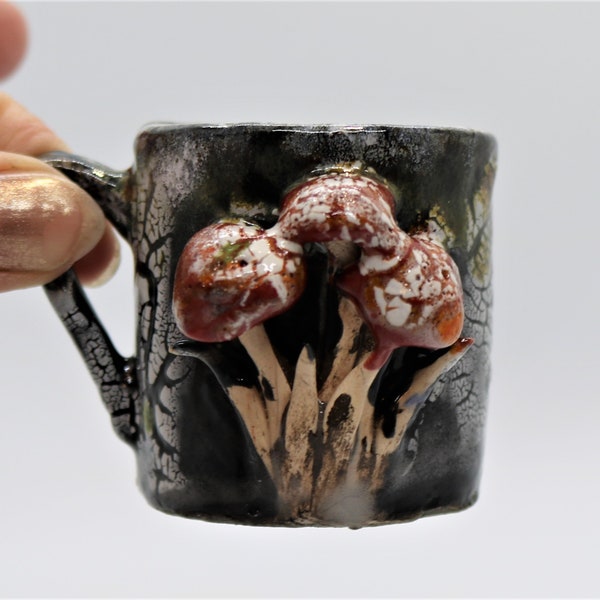 Hand made teeny tiny weenie espresso cup with red and white toadstool design on a black background, small espresso mug, black, fungi, nature