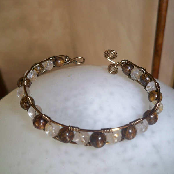 Bracelet en bronzite et quartz rutile.