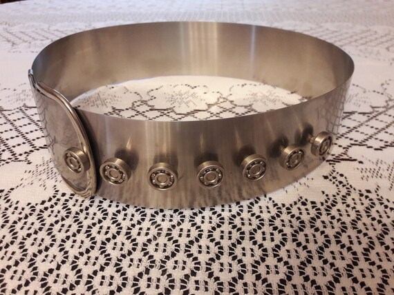 Wide rigid metal belt, futuristic Paco Rabanne sty