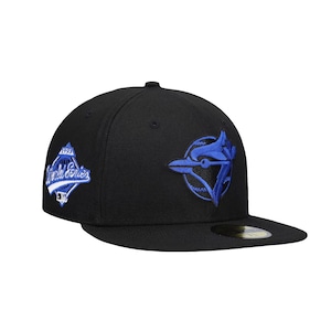 May include: Black baseball cap featuring a blue embroidered logo of a bird and the text "World Series 1993". The cap has a flat brim and a fitted design, suitable for sports fans.