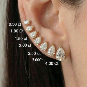 May include: A series of pear-shaped diamond stud earrings, ranging in size from 0.50 ct to 4.00 ct, are displayed on an ear. The diamonds are set in gold, showcasing their brilliance. The sizes are labeled next to each earring.