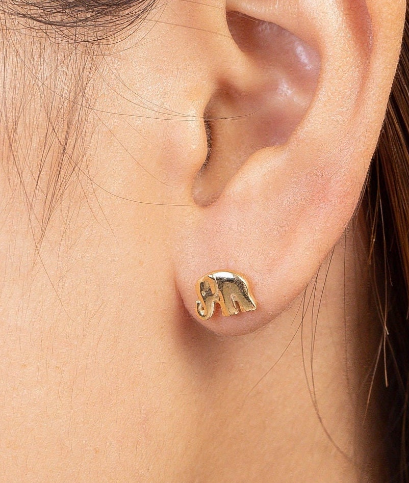 Gold elephant shop stud earrings