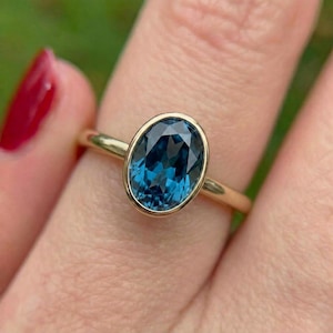 Captivating Oval London Blue Topaz Ring | 14K Gold Bezel Set Solitaire | Deep Blue Gemstone Engagement Ring | Stacking Ring