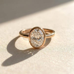 Elegant Oval Moissanite Bezel Set Engagement Ring | 14K Gold Solitaire ...
