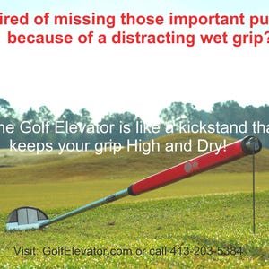 May include: A red golf flag on a green golf course. A red and silver golf club with a red grip is lying on the ground. The text "The Golf Elevator is like a kickstand that keeps your grip High and Dry!" is displayed above the club. The text "Visit: GolfElevator.com or call 413-203-5384" is displayed below the club.