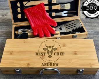 May include: A bamboo grilling set with 11 pieces, including a spatula, tongs, a brush, and a glove. The set comes in a wooden box with a cow head logo and the text "Best Chef Andrew".