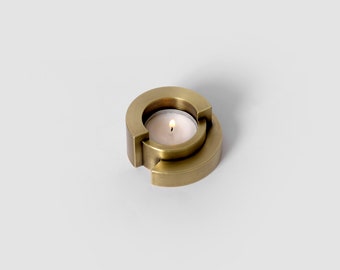 Tea light holder with aged brass finish