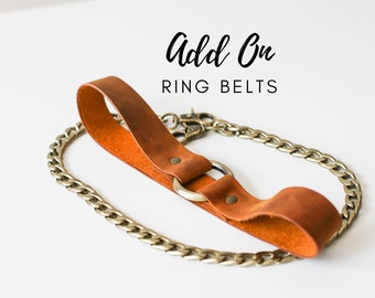 Puede incluir: Cinturón de anillo de cuero marrón con una cadena plateada. Add On RING BELTS. Hecho de cuero de vaca Crazy Horse de la más alta calidad.