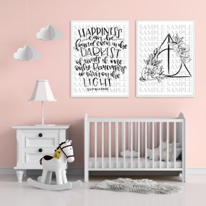 May include: Two black and white prints with inspirational quotes. The first print says "Happiness can be found even in the darkest of times if one only remembers to turn on the light - Dumbledore". The second print features a floral design with a triangle in the centre.