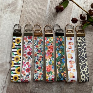 Llavero de pulsera con cordón de piel sintética de 15 cm, llavero con diseño floral y estampado animal.