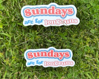 May include: Two rectangular stickers with the text "sundays are for long runs". The word "sundays" is in red, outlined in white, and set against a blue background. The phrase "are for long runs" is in white with a red outline.