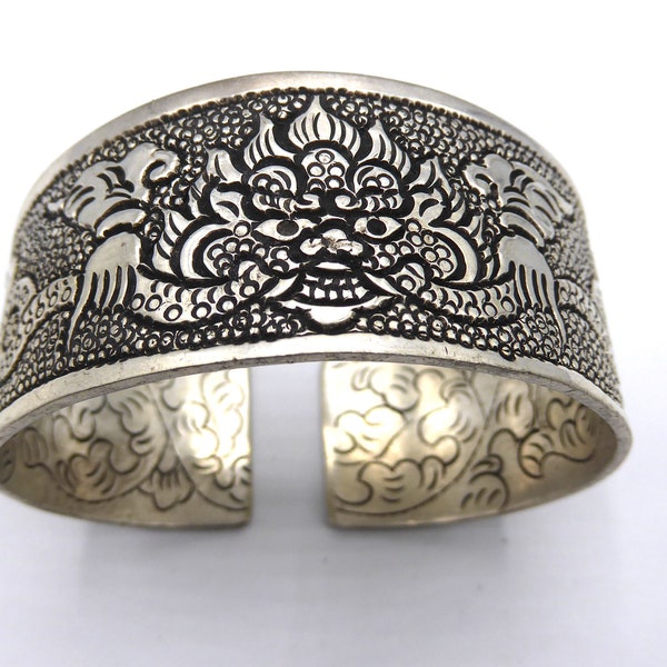 Chunky Handmade White Metal Cuff. Ethnic Bracelet with Tibetan Dragon Engravings.