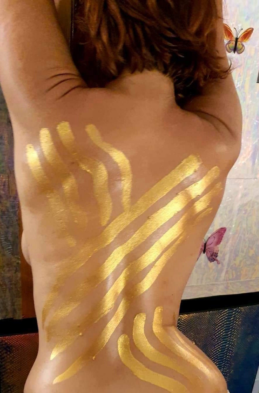 liquid gold body paint, woman, portrait, face like k