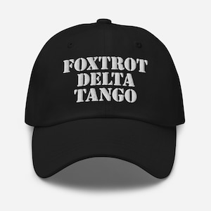 May include: Black baseball cap with white embroidered text that reads "FOXTROT DELTA TANGO".