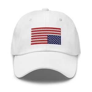 May include: White baseball cap with an embroidered American flag design. The flag is upside down, with the stars on the bottom and the stripes on the top.