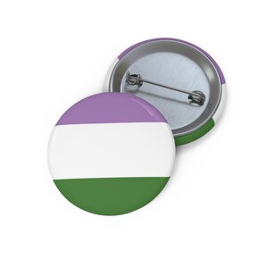 May include: A round button with a purple, white, and green striped design. The button has a metal back with a pin for attaching to clothing.