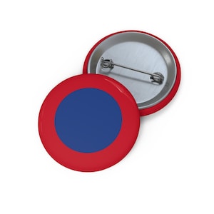May include: A red and blue button with a circle design. The button is 1.25 inches in diameter.